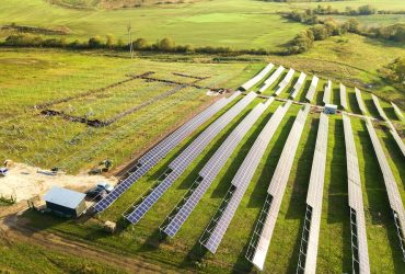 aerial-view-solar-power-plant-construction-green-field-assembling-electric-panels-producing-clean-ecologic-energy_127089-15485